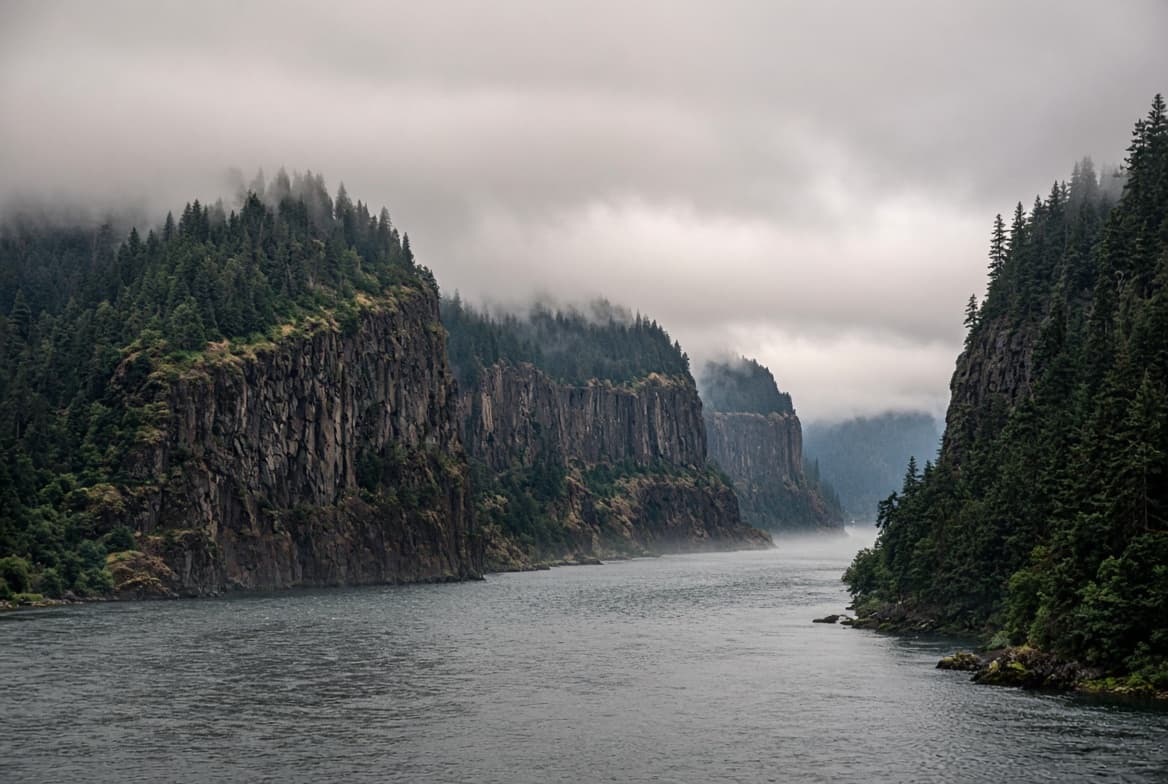 Basalt cliffs above the Columbia River in fog, representing Oregon Health Authority licensure